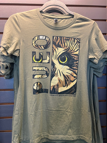 Pueo Wahine Slim Fit T-Shirt in Light Olive color.  The fitted t-shirt features 100% preshrunk 32-single, 4.3 oz. Combed & Ring-spun cotton (Heathers contain some polyester). PUEO design printed on the front of the shirt. This particular cut runs small. We suggest sizing up one or two sizes depending on how fitted or loose you prefer your shirts.