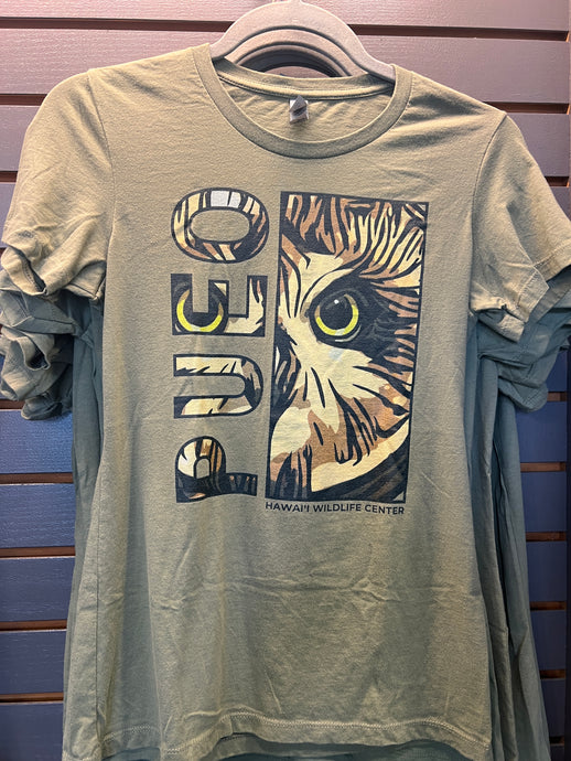 Pueo Wahine Slim Fit T-Shirt in Light Olive color.  The fitted t-shirt features 100% preshrunk 32-single, 4.3 oz. Combed & Ring-spun cotton (Heathers contain some polyester). PUEO design printed on the front of the shirt. This particular cut runs small. We suggest sizing up one or two sizes depending on how fitted or loose you prefer your shirts.