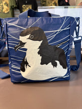 Load image into Gallery viewer, Back view of the Life on Water crossbody bag. Illustration is of a Hawaiian Petrel with wavy lines in the background. 
